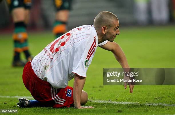 Mladen Petric of Hamburg looks dejected during the DFB Cup Semi Final match between Hamburger SV and SV Werder Bremen at the HSH Nordbank Arena on...