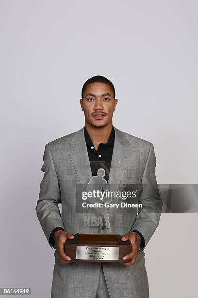 Portrait of Derrick Rose of the Chicago Bulls with the Eddie Gottlieb trophy presented to the T-Mobile NBA Rookie of the Year on April 22, 2009 at...