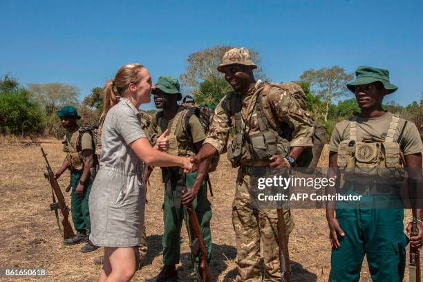 British High Commissioner in Malawi, Holly Tett , greets Malawian born British soldier Counter Poaching Operator and one of the trainers in a Game...