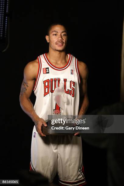 Derrick Rose of the Chicago Bulls poses during a video shoot with the Eddie Gottlieb trophy presented to the T-Mobile NBA Rookie of the Year on April...