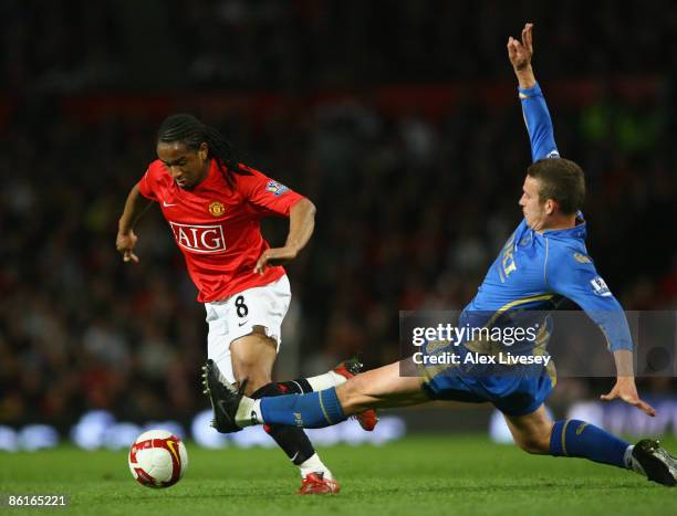 Anderson of Manchester United eludes the tackle of Sean Davis of Portsmouth during the Barclays Premier League match between Manchester United and...