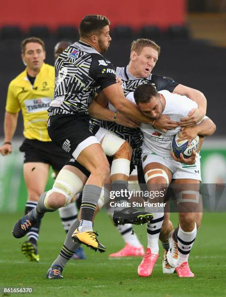 Rhys Webb and Bradley Davies combine to stop Alexandre Lapandry of Clermont during the European Rugby Champions Cup match between Ospreys and ASM...