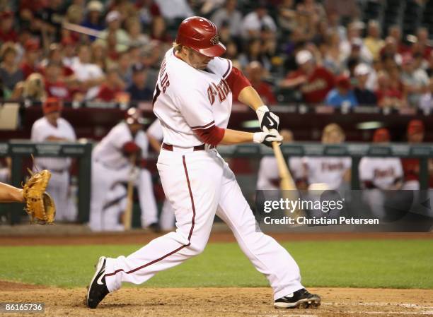 Mark Reynolds of the Arizona Diamondbacks hits a single against the Colorado Rockies during the game at Chase Field on April 22, 2009 in Phoenix,...