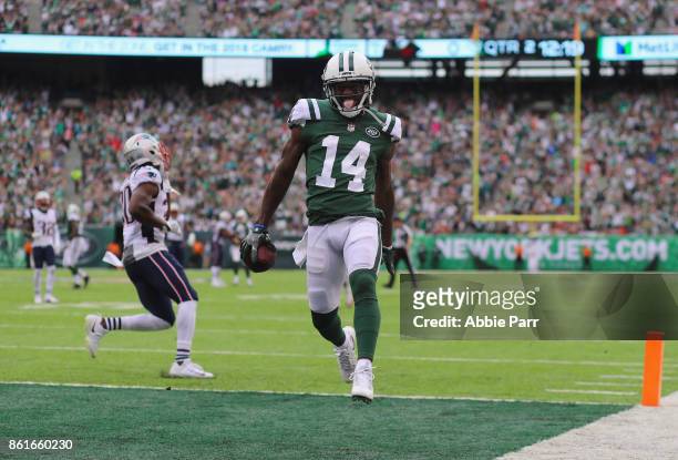 Wide receiver Jeremy Kerley of the New York Jets runs in a 31-yard touchdown against the New England Patriots during the second quarter of their game...