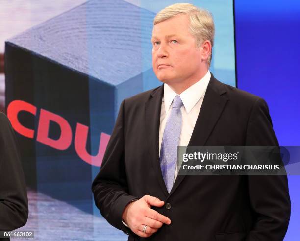 The top candidate of conservative Christian Democratic Union Bernd Althusmann looks on ahead of a television debate on the election results of the...