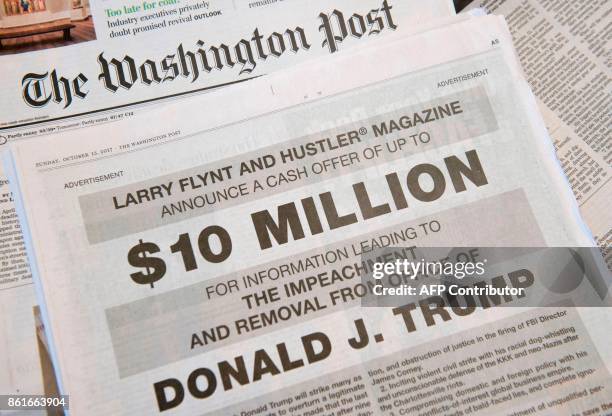 Photo taken on October 15, 2017 in in Washington, DC shows a full-page newspaper advertisement in the Washington Post offering 10 million dollars...