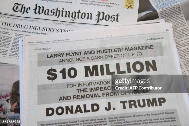 Photo taken on October 15, 2017 in in Washington, DC shows a full-page newspaper advertisement in the Washington Post offering 10 million dollars...