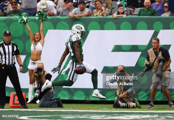 Wide receiver Jeremy Kerley of the New York Jets runs in a 31-yard touchdown against the New England Patriots during the second quarter of their game...