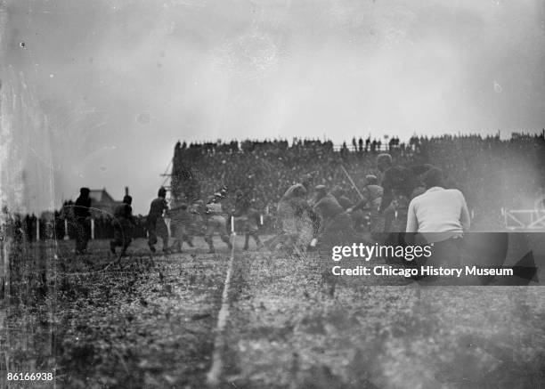 Image of receivers and defenders running away from center lines during a University of Chicago-University of Michigan football game at Regents Field...