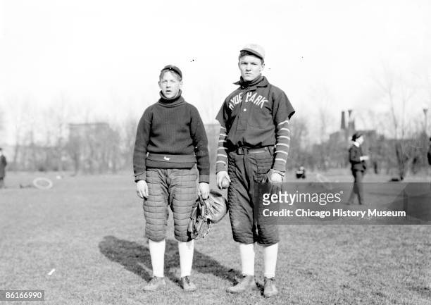 Full-length portrait of Dusty Hunt, a baseball player in Hyde Park High School, standing with an unidentified player on an athletic field in the Hyde...