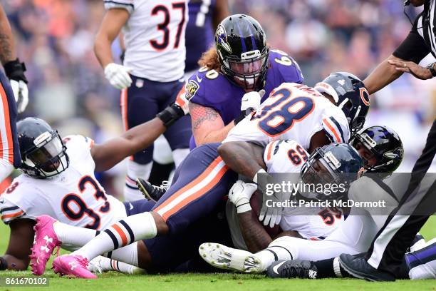 Inside Linebacker Danny Trevathan of the Chicago Bears recovers a fumble in the second quarter against the Baltimore Ravens at M&T Bank Stadium on...