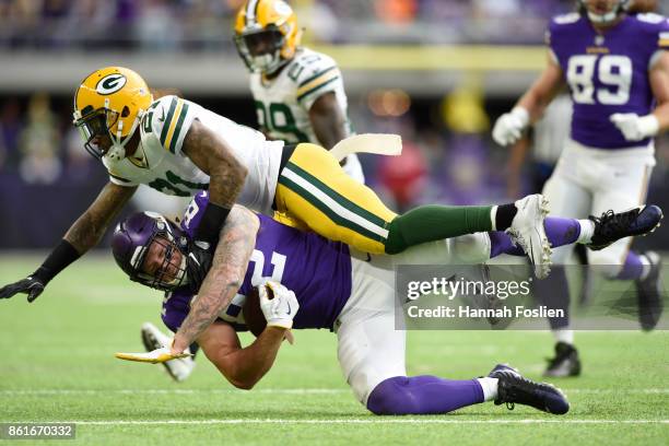 Kyle Rudolph of the Minnesota Vikings is tackled by Ha Ha Clinton-Dix of the Green Bay Packers after a reception during the second quarter of the...