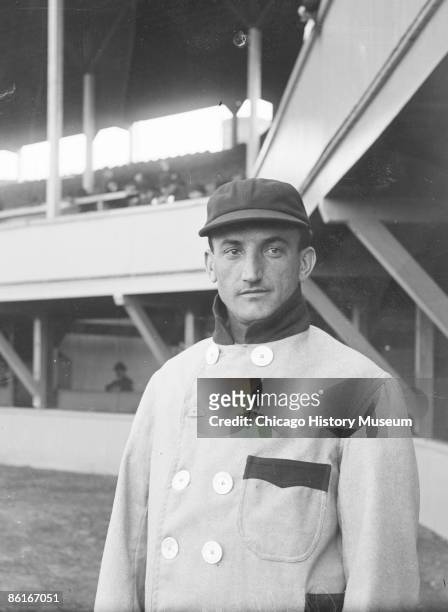 Half-length portrait of Bobby Wallace, shortstop, St. Louis Browns, American League, standing near the grandstand concourse at South Side Park which...