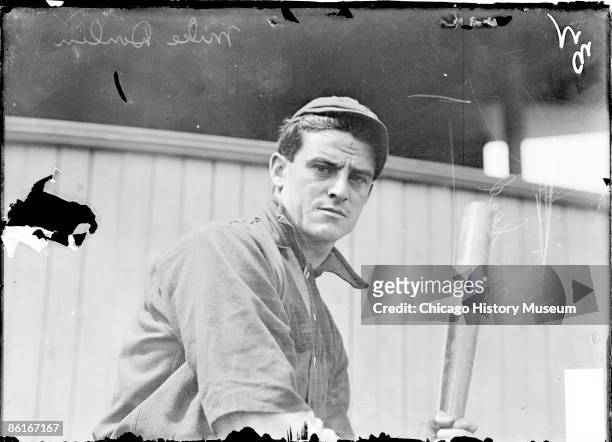 Half-length portrait of baseball player, Mike Donlin, also known as Turkey Mike, left fielder for the Cincinnati Reds, National League, standing in...