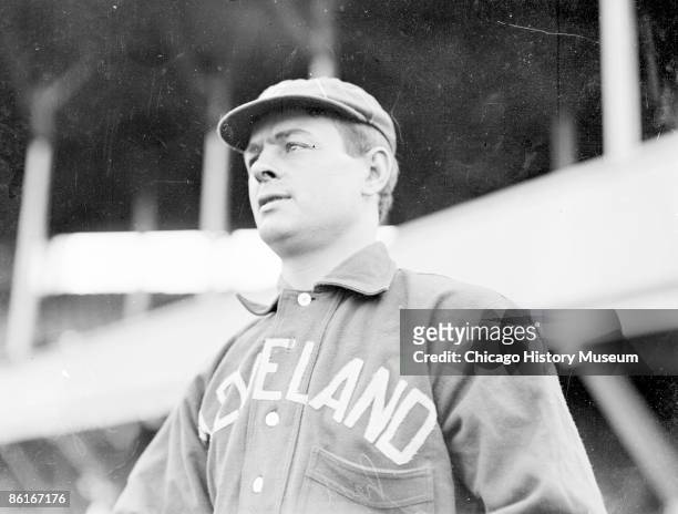 Half-length portrait of baseball player, Elmer Harrison Flick, outfielder for the Cleveland Naps, American League, standing outside the dugout at...