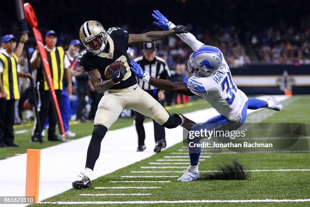 Hayden of the Detroit Lions forces Ted Ginn of the New Orleans Saints out of bounds during the first half of a game at the Mercedes-Benz Superdome on...