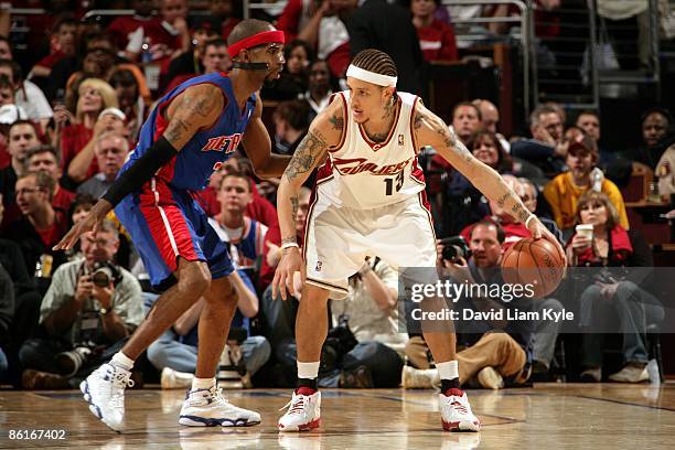 Delonte West of the Cleveland Cavaliers moves the ball against Richard Hamilton of the Detroit Pistons in Game One of the Eastern Conference...