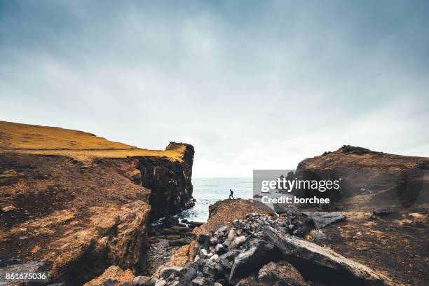 hiking on valahnukur cliffs in iceland - wide angle stock pictures, royalty-free photos & images