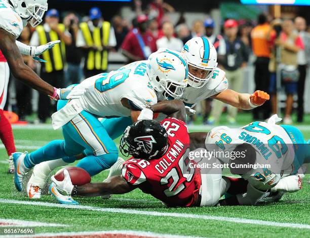 Tevin Coleman of the Atlanta Falcons rushes for a touchdown against the Miami Dolphins at Mercedes-Benz Stadium on October 15, 2017 in Atlanta,...