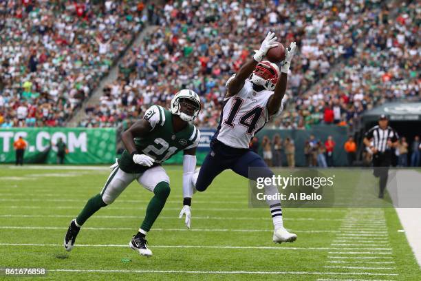 Wide receiver Brandin Cooks of the New England Patriots makes a catch against cornerback Morris Claiborne of the New York Jets during the second...