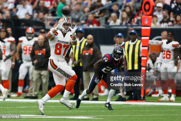 Seth DeValve of the Cleveland Browns catches the ball defended by Johnathan Joseph of the Houston Texans in the second quarter at NRG Stadium on...