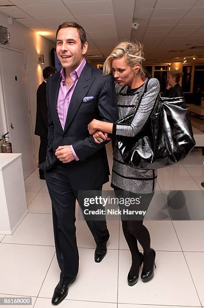 Comedian David Walliams and model Kate Moss attend the unveiling of the 'White Light' diamond brooch designed by Shaun Leane at Millbank Tower on...