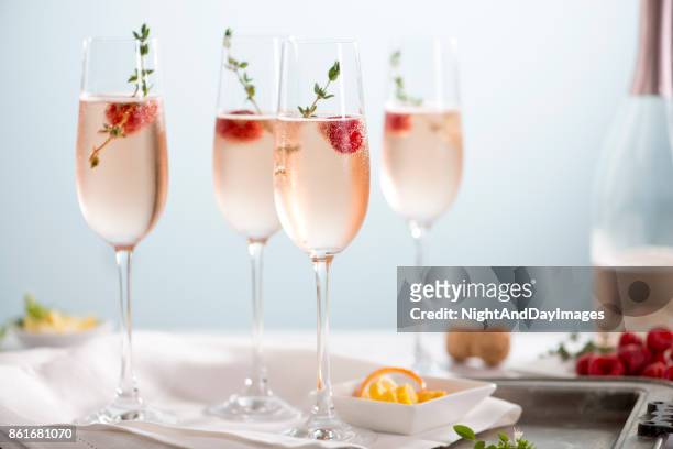 rose champagne cocktails - champagne stock pictures, royalty-free photos & images