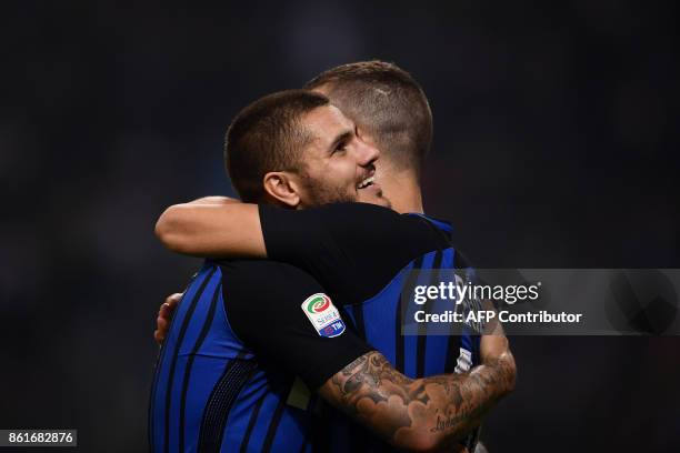 Inter Milan's forward Mauro Icardi from Argentina celebrates with teammate Inter Milan midfielder Ivan Perisic after scoring during the Italian Serie...