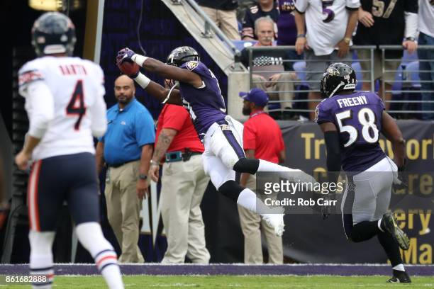 Running Back Bobby Rainey of the Baltimore Ravens scores a touchdown on a kick return in the third quarter against the Chicago Bears at M&T Bank...