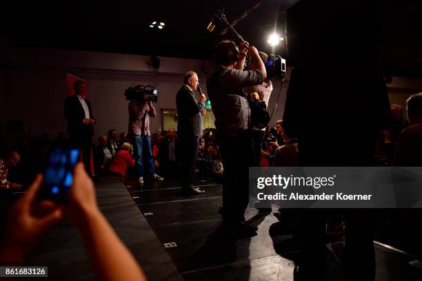 Stephan Weil, incumbent candidate of the German Social Democrats , speaks and celebrates with supporters following initial results that give the SPD...