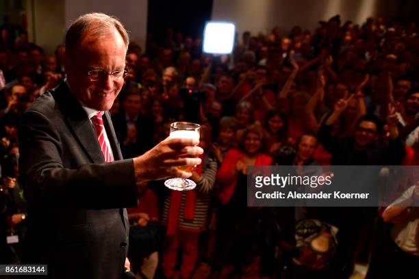 Stephan Weil, incumbent candidate of the German Social Democrats , speaks and celebrates with supporters following initial results that give the SPD...