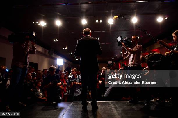 Stephan Weil, incumbent candidate of the German Social Democrats , speaks and celebrates with supporters following initial results that give the SPD...