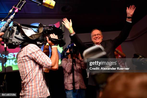 Stephan Weil, incumbent candidate of the German Social Democrats , speaks and celebrates with supporters following initial results that give the SPD...