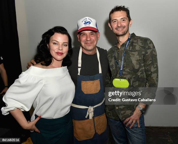 Debi Mazar, Chef Michael Symon, and Chef Gabriele Corcos attend the Food Network & Cooking Channel New York City Wine & Food Festival Presented By...