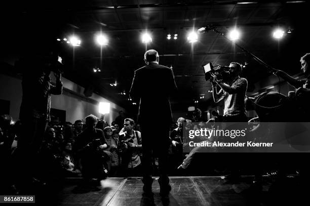 Stephan Weil, incumbent candidate of the German Social Democrats , speaks and celebrates with supporters following initial results that give the SPD...