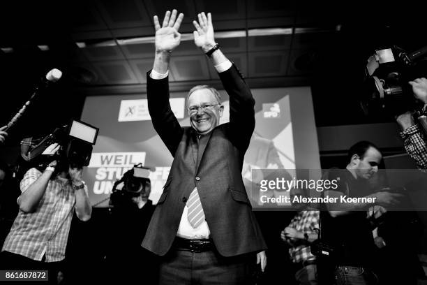 Stephan Weil, incumbent candidate of the German Social Democrats , speaks and celebrates with supporters following initial results that give the SPD...