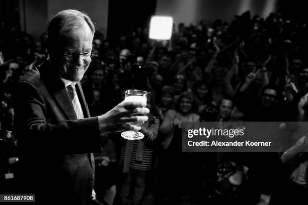 Stephan Weil, incumbent candidate of the German Social Democrats , speaks and celebrates with supporters following initial results that give the SPD...