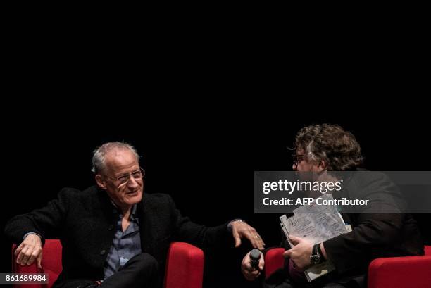 Film director Michael Mann speak with Mexican film director Guillermo del Toro during a panel discussion on October 15, 2017 in Lyon, during the 9th...