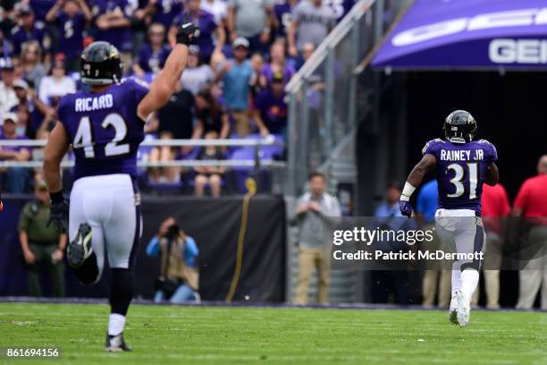Running Back Bobby Rainey of the Baltimore Ravens runs a kick return for a touchdown in the third quarter against the Chicago Bears at M&T Bank...