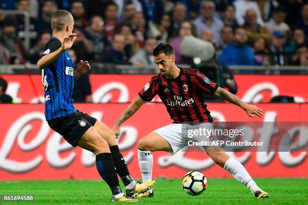 Milan's Spanish forward Fernandez Suso vies with Inter Milan's Croatian forward Ivan Perisic during the Italian Serie A football match Inter Milan Vs...