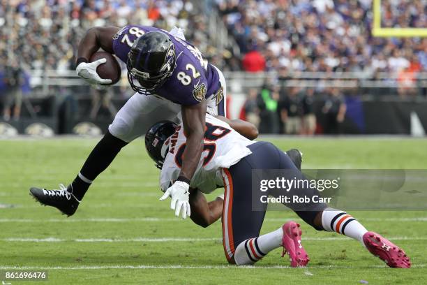 Tight End Benjamin Watson of the Baltimore Ravens is tackle after a completion by strong safety Adrian Amos of the Chicago Bears at M&T Bank Stadium...