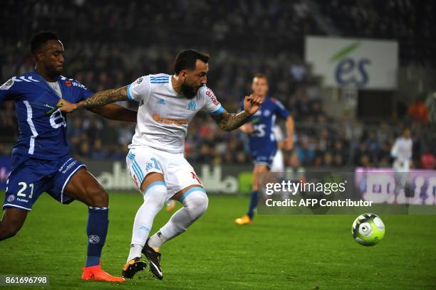 Strasbourg's French defender Yoann Salmier vies with Olympique de Marseille's Greek forward Konstantinos Mitroglou during the French Ligue 1 football...