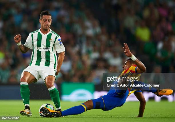 Sergio Leon of Real Betis Balompie being fouled by Jeison Murillo of Valencia CF during the La Liga match between Real Betis and Valencia at Estadio...