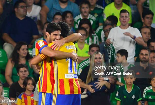 Valencia's Portuguese forward Goncalo Guedes celebrates after scoring a goal during the Spanish league football match Real Betis FC vs Valencia FC at...