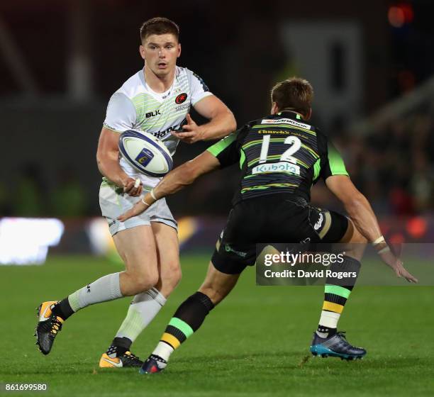 Owen Farrell of Saracens passes the ball during the European Rugby Champions Cup match between Northampton Saints and Saracens at Franklin's Gardens...