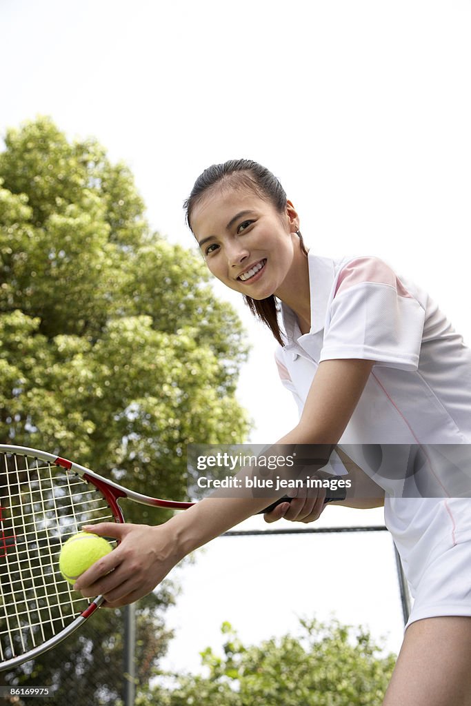 Young woman playing tennis