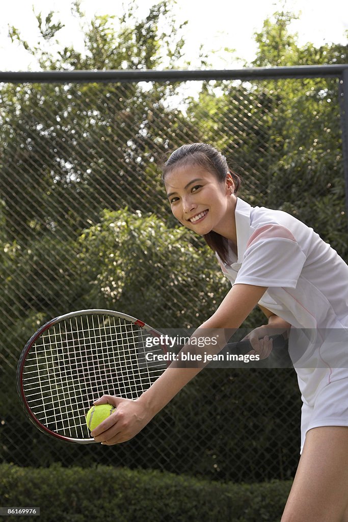 Young woman playing tennis