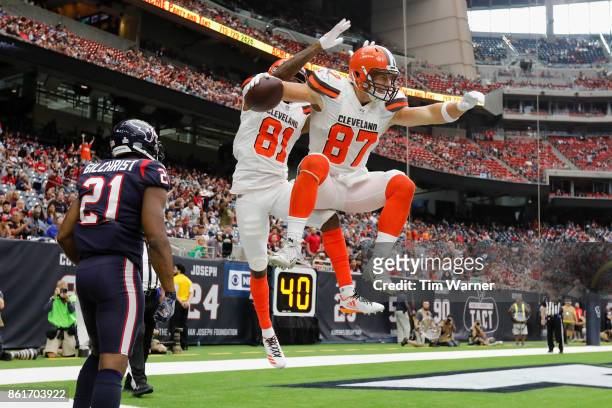 Rashard Higgins of the Cleveland Browns celebrates with Seth DeValve after a touchdown in the fourth quarter defended by Marcus Gilchrist of the...