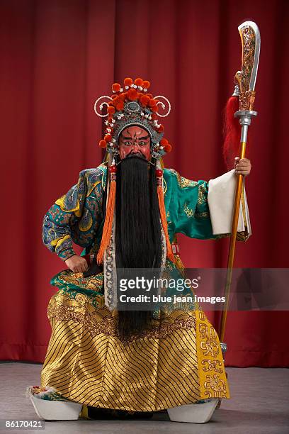 guang gong, ancient chinese general in beijing opera costume, represents protection and wealth - peking opera stock pictures, royalty-free photos & images