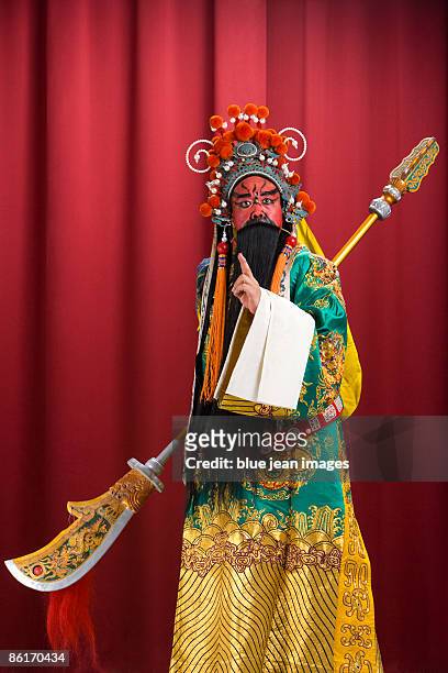guang gong, ancient chinese general in beijing opera costume, represents protection and wealth - peking opera stock pictures, royalty-free photos & images